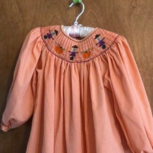 Orange and white smocked dress